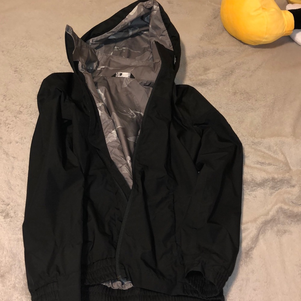Black waterproof jacket by the north face company